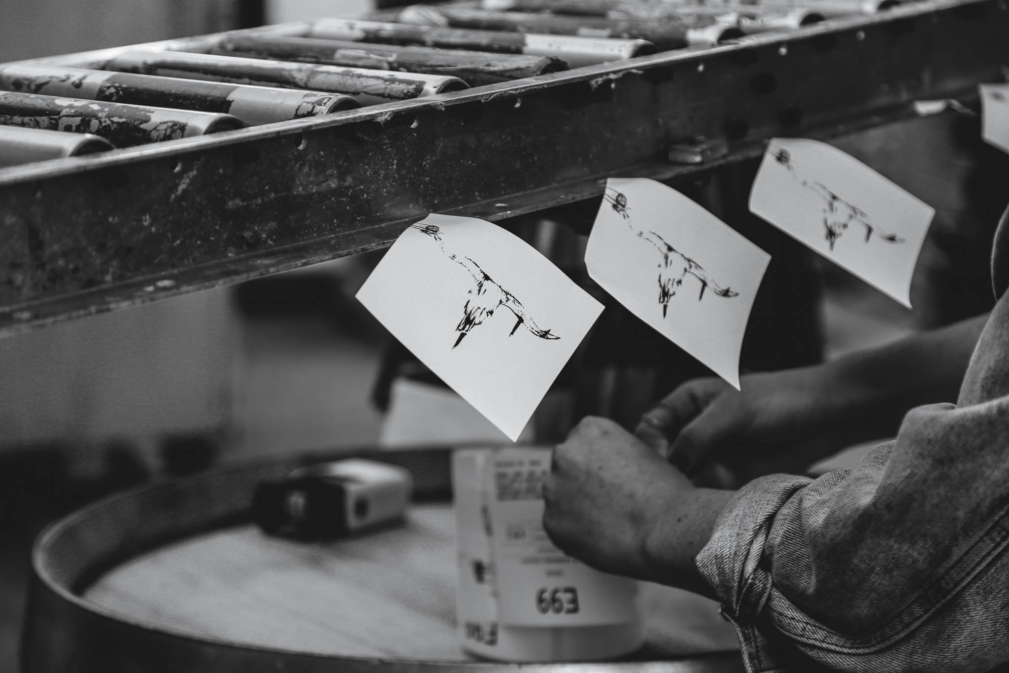 Black and White Photograph of Levo E99 Labels on Bottling Day by Paso Robles Wine Photographer Amarie Design Co.. 
